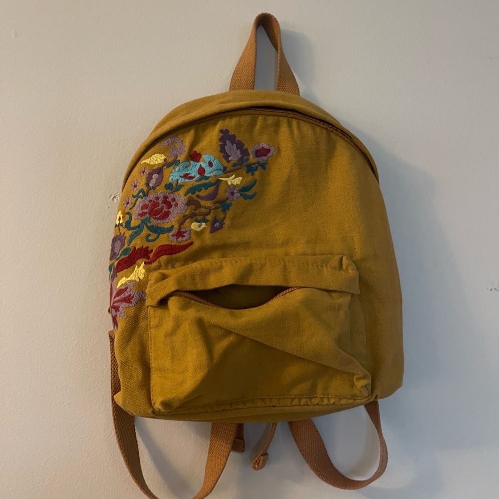 Earthbound mustard colored embroidered backpack